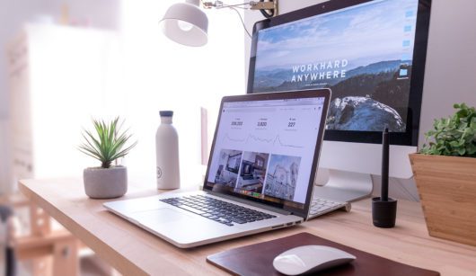 laptop and desktop computers on desk