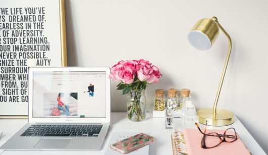 desk with open laptop