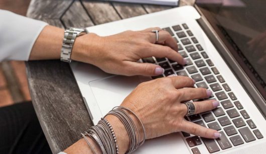 woman typing on laptop