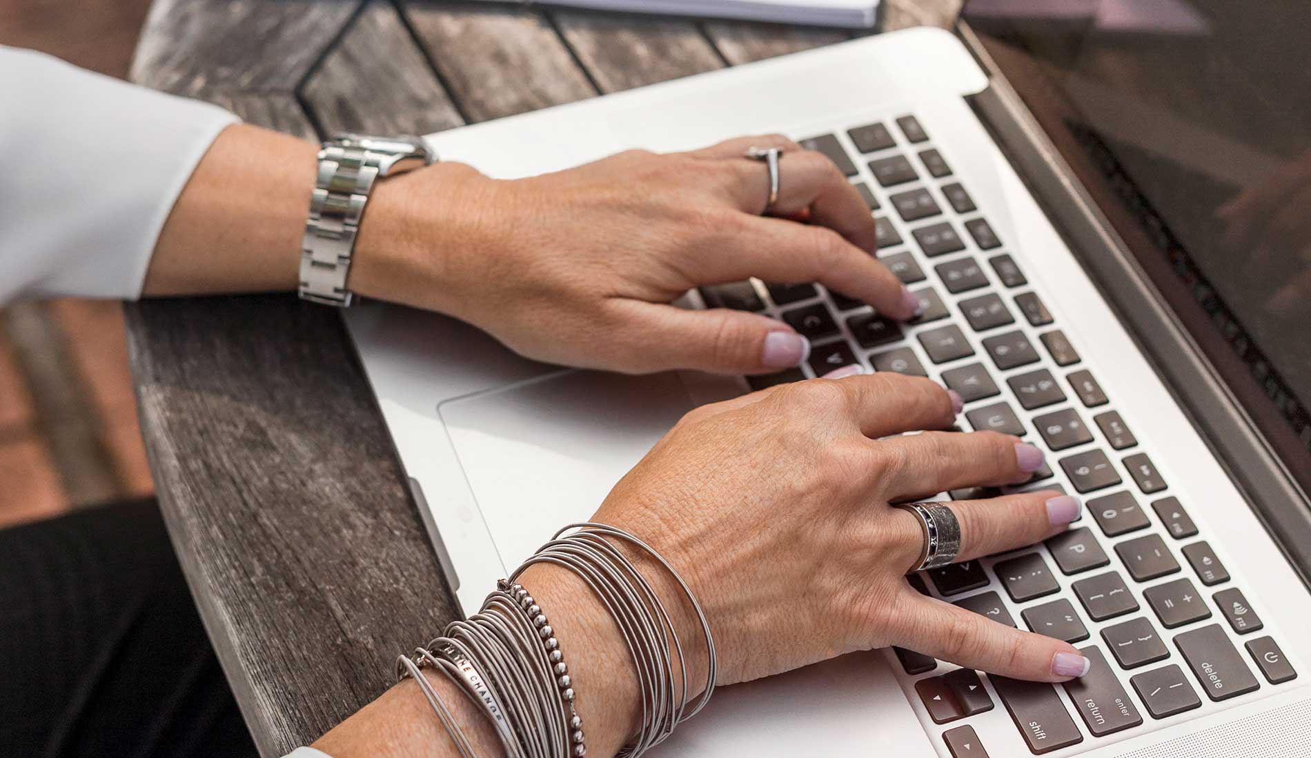 woman typing on laptop